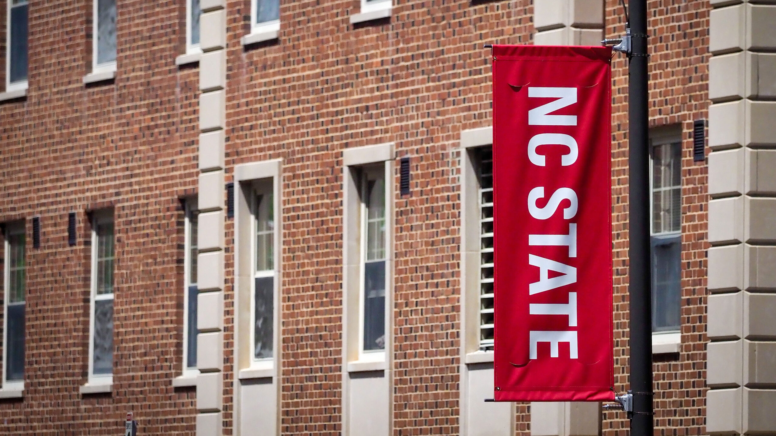 NC State banners line Cates Avenue in front of Tucker residence hall. Photo by Becky Kirkland.